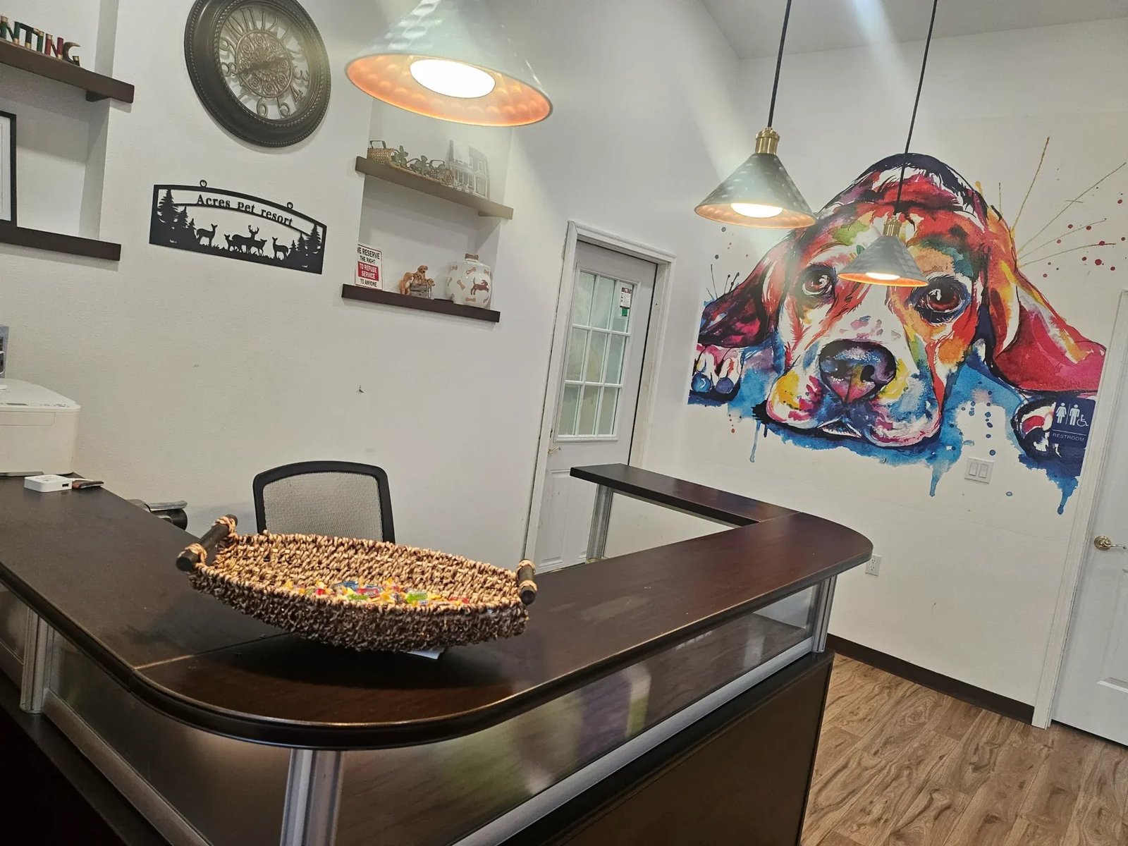 Reception area at Acres Pet Resort with custom dog mural